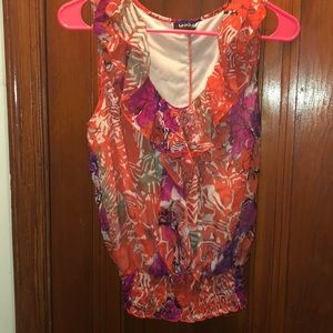 Unique spectrum top in orange and plum tones.